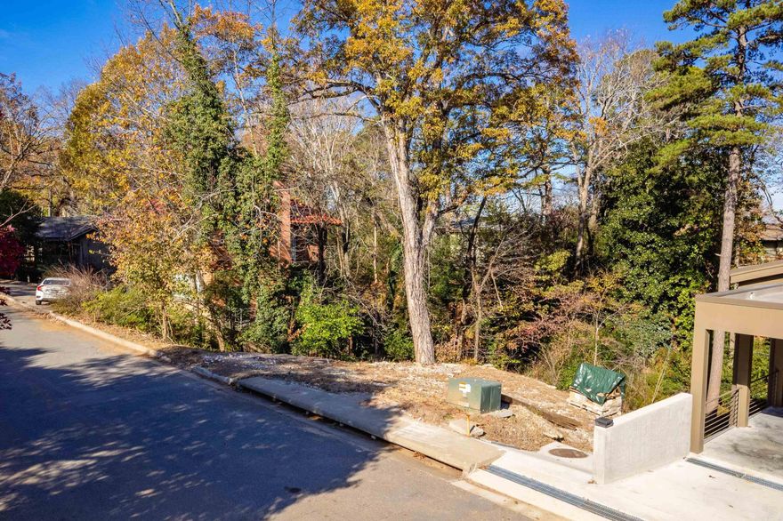 Yes!!  You have the opportunity to build your new home in one of the most beautiful locations in the Heights!!  Perfect lot for a thinking outside of the box!!   This lot is 65 feet wide with 5 foot easement on each side!!  This lot overlooks  small creek and looks into the hillside!!  This lot goes past the creek about 10 feet!!  All utilities are in place---gas, electricity, water!  Sewer tap already installed!    Grand opportunity to build a home of your dreams in a very quiet area of the Heights!!  Take a look at the beautiful contemporary to the right!!