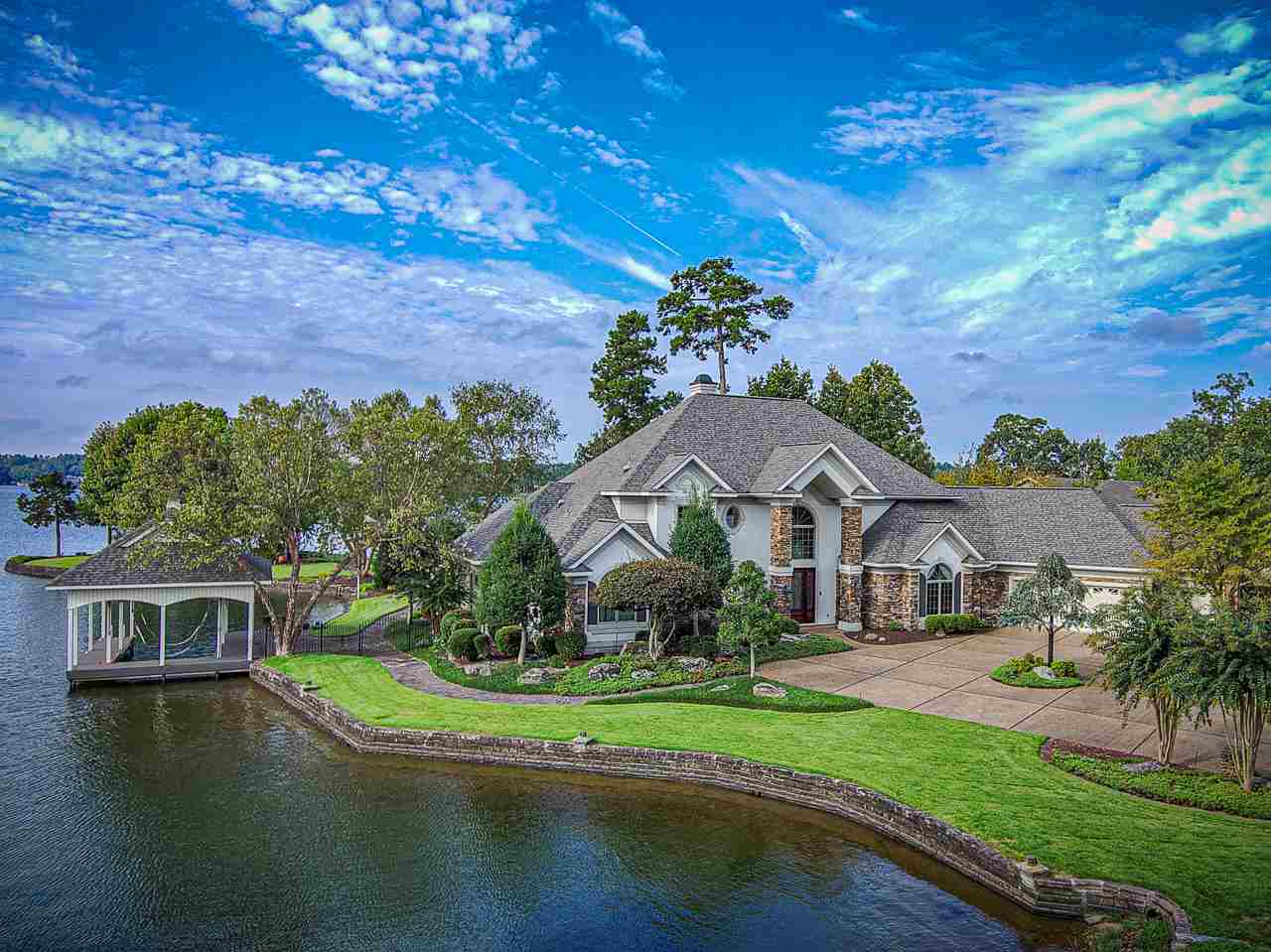 This may be the very best lot on Lake Balboa w/the most prestigious house!Should it be necessary in HSV, just quarantine me in 61 Resplandor Way!This beautiful very custom home was built for the discriminating buyer w/an appreciation for quality,opulence, & grandeur.Live & live grandly w/a view of water from virtually every window - there are many & they are large.Everything for life is on the entry level w/guest rooms upstairs for their quiet enjoyment.