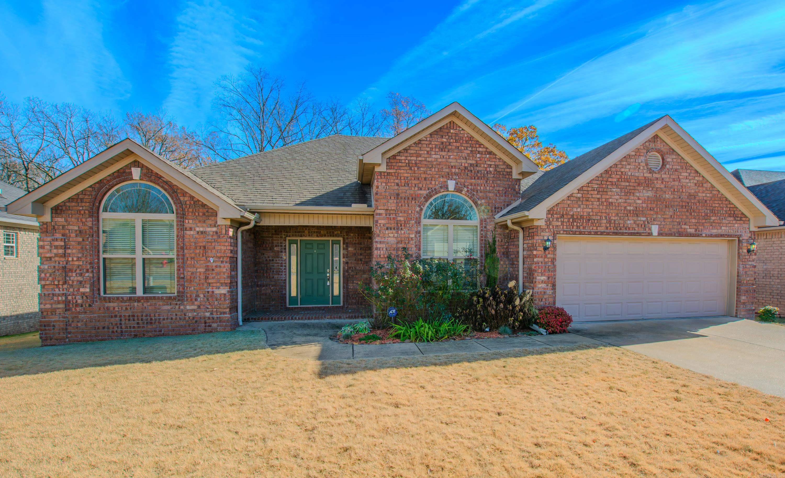 This stunning one-level home is on a quiet, low traffic cul-de and features an open floor plan that's perfect for modern living. split bedroom layout provides extra privacy in the primary bedroom & conveniently separate from the other bedrooms. Inside, you'll find wood-like, a cozy corner fireplace, and a large picture window that overlooks the expansive backyard. The outdoor space boasts a generous deck and backs up to wooded area, ensuring extra privacy while you enjoy watching wildlife from your back deck. Additional highlights include a spacious laundry room with ample storage, a kitchen equipped with granite countertops, a center island, double ovens, and elegant walnut-stained cabinets. The Master bath has a jetted tub, separate shower and an oversized walk-in closet.