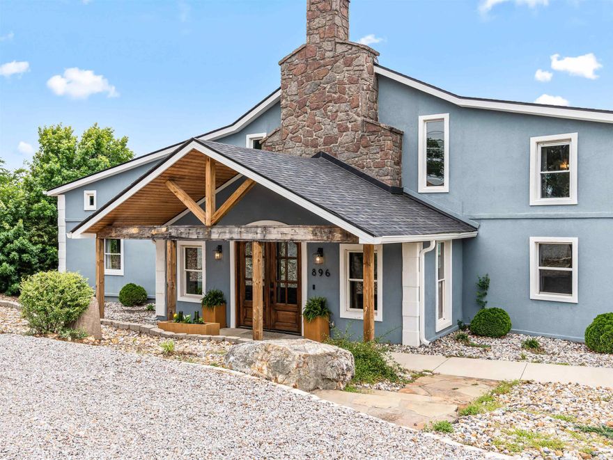 Perched atop Mt. Riante with sweeping views of Lake Hamilton and the Ouachita Mountains, this 7,300 sq ft, 7-bed/5.5-bath estate spans three levels, each with its own private deck. Bold teal chef's kitchen, floor-to-ceiling stone fireplace, 12-person dining room wrapped in lake-view windows, spa primary suite with jetted tub overlooking Lake Hamilton, game room, pool table, bunk room, and a covered hot tub under string lights. What sets this apart: mini-split HVAC keeps average electric at just $339/month on 7,300 sq ft. Well and septic mean zero city utility bills. County property taxes just $7,679/year — and no city tax. Active STR with proven revenue. Listed below appraised value-appraisal completed March 2026. Sold fully furnished. Lakeside School District. Gated community. $1,200/yr HOA covers road, gate, and dumpster. STR data available upon request.