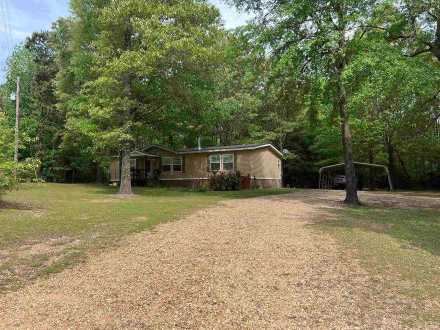 scape to Serenity on Over 8 Acres Welcome to 1836 Ouachita in Stephens, where country living meets modern comfort. Built in 2010, this Deer Valley modular home offers 1,680 square feet of thoughtfully designed living space, nestled on over 8 acres of peaceful, secluded land. For outdoor enthusiasts, the property boasts a personal hunting area complete with two stands that remain with the property. A storage building provides ample room for equipment and tools, while the spacious front and back porches—including a screened section—offer the perfect spots to relax and enjoy the tranquil surroundings. Inside, you’ll find a cozy wood-burning fireplace in the living room, a spacious kitchen with newer appliances, and a primary suite featuring a walk-in closet, a soaker tub, and double vanities. Recent updates include a newer HVAC system and hot water heater, and so much more additions available to your agent when setting up appointments. Priced at $149,900, this property is a must-see for those seeking a private retreat with modern amenities. The seller requests preapproval prior to scheduling showings. Contact your agent today for more information and to arrange an appointment.