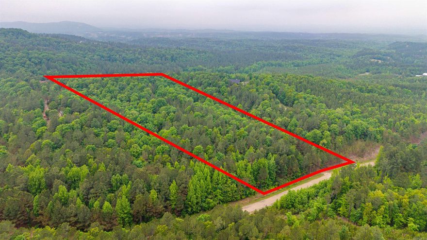 Discover the perfect blend of privacy and natural beauty with this 11-acre tract on Ten Mile Rd. in Hot Springs. Ideal for your dream home, this property offers multiple potential building sites with scenic mountain views and a peaceful, rural setting. With no restrictions, you’ll have the freedom to design and build exactly what you envision—whether it’s a custom home, cabin retreat, or weekend getaway.  The land features a great mix of open space and wooded areas, providing both usability and seclusion. Abundant wildlife makes this property a nature lover’s paradise, perfect for enjoying the outdoors right out your back door. Convenient paved road frontage ensures easy access year-round, while still maintaining that quiet, country feel.  Located just a short drive from all the amenities of Hot Springs, in Fountain Lake School District, you’ll enjoy the best of both worlds—privacy and convenience. Opportunities like this are getting harder to find—don’t miss your chance to own a beautiful piece of Arkansas land with endless potential.
