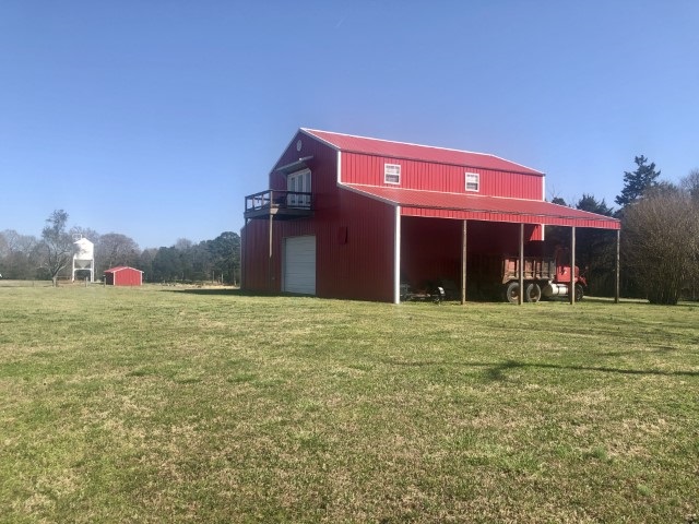 One of a Kind Gated Cattle Farm w/Two Bedroom One Bath Apartment over Barn! Rolling Pasture, 5 ponds, Set up for your Cows or Horses. Fenced & Cross Fenced Beautiful Sunsets, Security gate provides privacy. Minerals DO NOT convey. Call Today for a Personal Tour of this property!