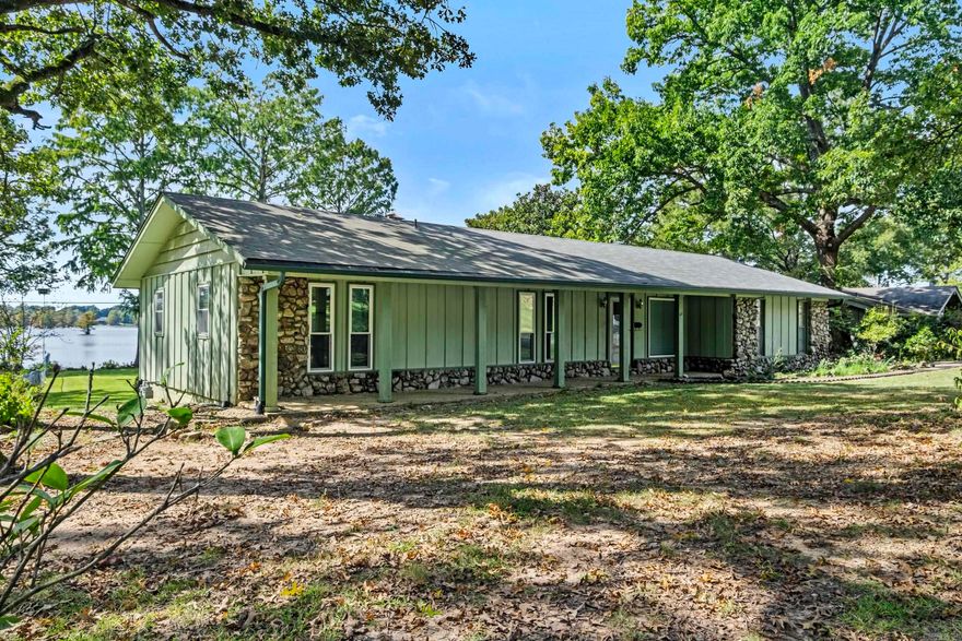 Wake up every day to breathtaking lake views in this 3 bedroom/2 bath home nestled on a serene waterfront lot. This property boasts a spacious sunroom perfect for relaxing or entertaining while enjoying the scenery year-round.  Inside you will find a cozy rock fireplace in the living area, adding rustic charm and warmth. There is endless potential for you to add your personal touch and modern updates. Additional features include a 2 car garage, RV parking with full hookup, and plenty of outdoor space to enjoy lake life all within minutes of the Little Rock Air Force Base.  Check this home out today.