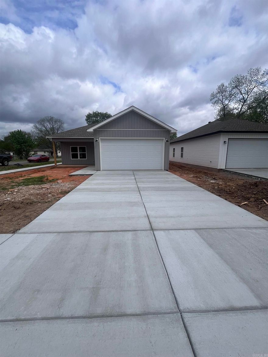 House is just 2 weeks from completion!  New 3 bedroom 2 bath construction conveniently located to Bryant High School.  Home has beautiful hybrid flooring throughout that gives the appearance of hand scraped hardwood. Kitchen and bathrooms are completed with 3cm granite and custom built cabinets. Master shower is tiled for a classic appearance and has double vanity. Nice walk-in closet in what you find behind the barndoor. Home boasts 9ft ceilings and LED lighting. Back patio perfect size for your grill and chairs for relaxing.  Don't miss this Bryant New construction opportunity.