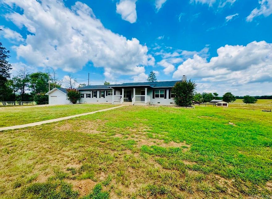 Welcome to your own private piece of tranquility of country living on 13.5 beautiful acres! The property spreads a total of 3615 sq/ft, including a 2115 sq/ft main house & 1500 sq/ft custom built cabin. The cabin is fully furnished & a perfect space for an inlaws suite or man cave.  Upon entering the completely remodeled house, the open concept flows from the living room to the very modern & sleek kitchen. Brand new appliances, granite countertops, flooring, paint & much more throughout are just a few of the updates that make this house so charming & inviting. The master suite has a special touch of a custom built closet that flows into the large & open tiled walk in shower. Over the fenced in 13.5 acres, several barns & sheds are the perfect place for any lifestock that you could want! Beautiful & peaceful land out in the country is hard to find, come see this unique property & all it has to offer! Agents see remarks.