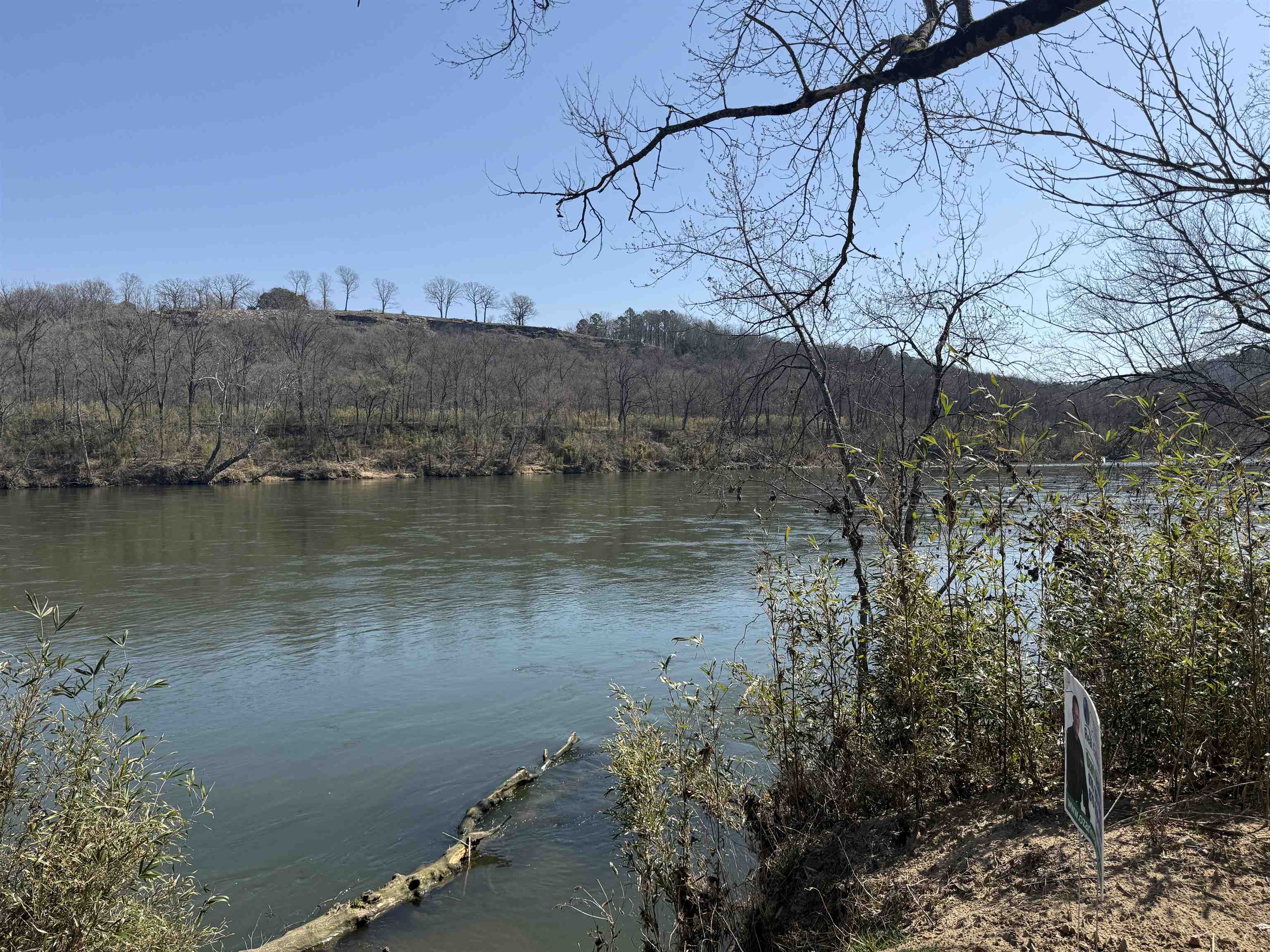 This RV-accessible riverfront lot offers 131 feet of prime frontage on the White River in Baxter County, Arkansas. Located in the Sneeds Creek Landing subdivision, this tract resides on the west side of the river, below Norfork, Arkansas and above Calico Rock, Arkansas. It is close to an Arkansas Game and Fish public boat ramp and the Ozark National Forest, making it an ideal spot for fishing, boating, and outdoor recreation. The lot features a level building site that has not flooded in the last 100-year flood, providing a secure foundation for future construction. With a gentle slope down to the river, itās perfect for enjoying riverfront views and activities. You can vacation in your RV now and build later, as the property already has underground electricity, a new driveway, and high-speed internet ready for hookup. Bank financing is available if needed. Donāt miss this opportunity to own this spacious riverfront lot for just $95,000!