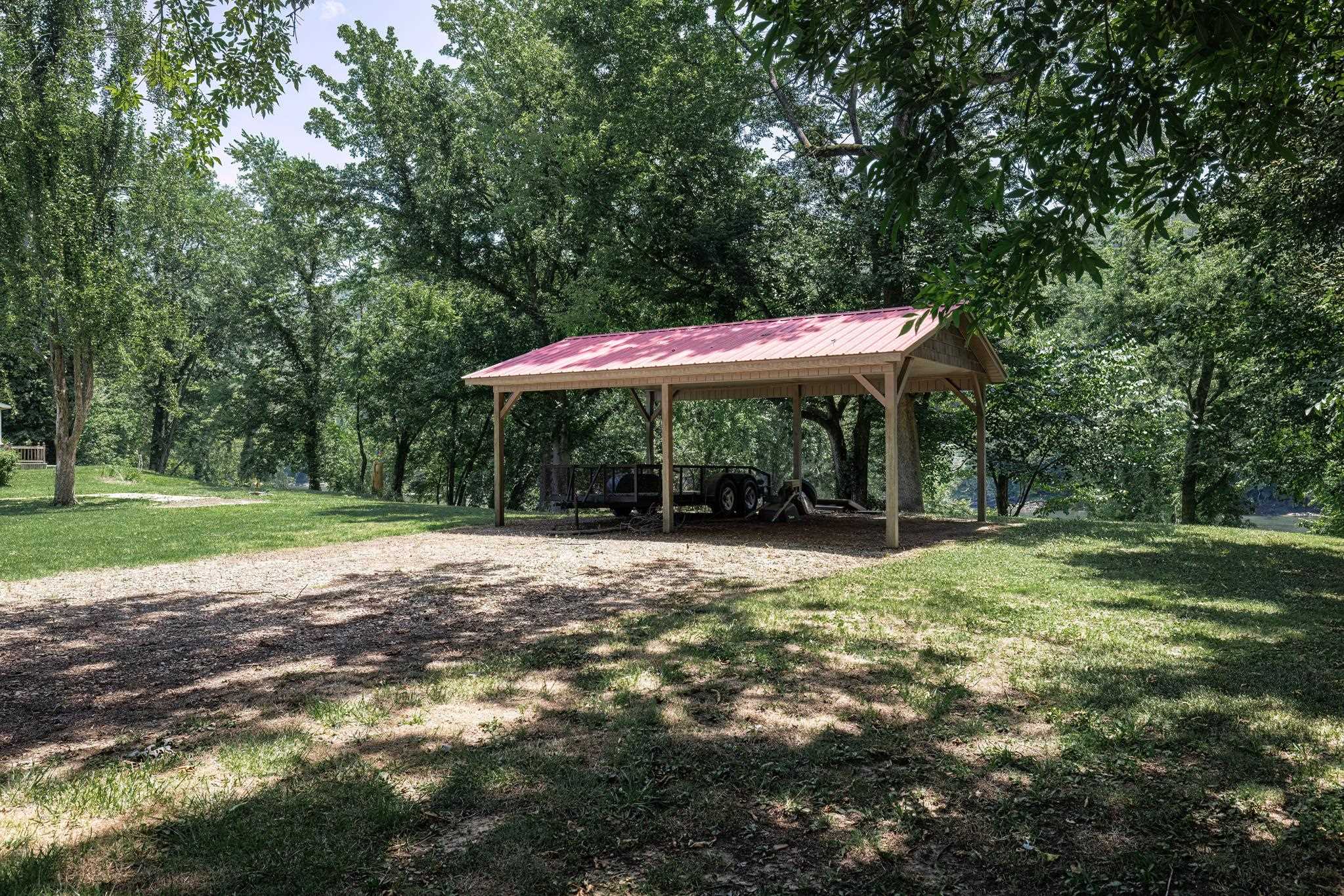 White River Frontage – 3 Cleared Lots with Utilities, Carport & Shed! One of the few last remaining riverfront opportunities in this secluded and highly desirable section of the White River! This offering includes three adjoining, cleared, and well-maintained lots — ready for your dream build, weekend retreat, or investment. With paved road access, utilities at the curb, and the original home footers still in place, you're steps ahead for a future home or cabin. The property also features a sturdy wooden carport, a storage shed, and gorgeous mountain views across open pasture land — all while being tucked away for maximum privacy. You’ll love the proximity to two of the most popular boat docks for guided fishing trips, boat rentals, dining and lodging, making it perfect for river adventures or entertaining guests. Whether you’re planning to build, relax, or invest, this rare gem offers White River access, scenic beauty, and peaceful seclusion—a truly unbeatable combination. Don't miss this chance to own riverfront property in one of the most tranquil and picturesque stretches of the White River!
