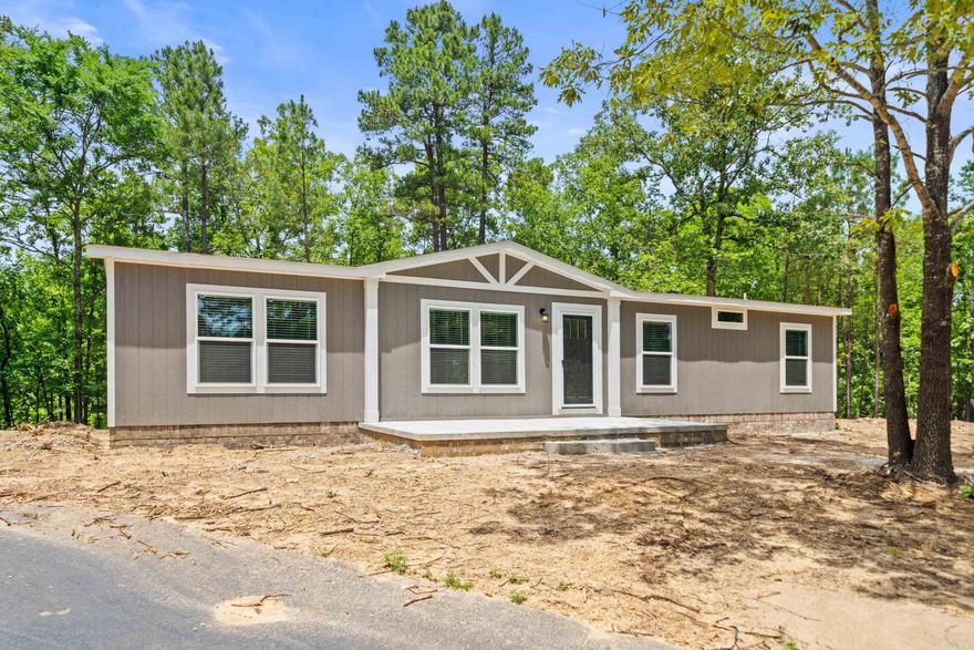 BRAND NEW 2025 CLAYTON HOME!!! siting on your own lovely 1.3 acre lot! Smart Panel exterior siding w a 50-year warranty! Five-year warranty on the HVAC. Spacious kitchen with Island and Samsung Stainless appliances, range, dishwasher, microwave, and refrigerator. Tiled shower in the master bath with a separate soaking tub to relax and enjoy after a long day!!  There will be beautiful brick around the perimeter, this will be a very nice Home with paved drive!!! Lovely setting with mature trees and private!! Mountain ridge view in the distance! You will not find another home at this price with all the bells and whistles at this !! Hurry to make your offer and its move in ready!!
