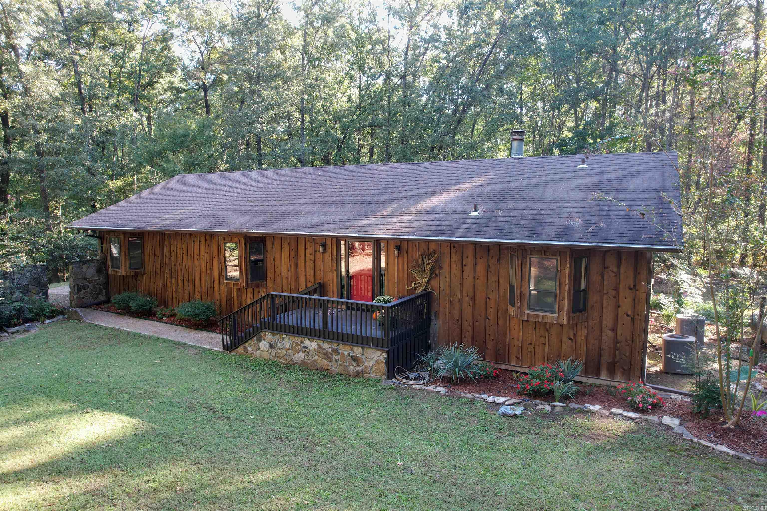 You don't want to miss this awesome updated home nestled on 5 acres of mature trees, barn and privacy. Beautiful landscaping. Kitchen has granite counters, stainless steel applicances, pantry with pull out drawers. Home offers, separate laundry room, gas fireplace, custom built cabinets, office, could be 5 bedrooms, marble shower, formal dining room, This is the perfect place to live! Come enjoy nature. Home is about 7.1 miles from Cabot Neighborhood Marker. Agents See Remarks
