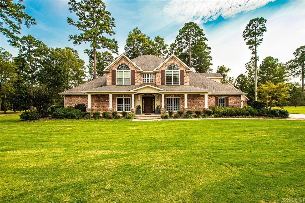 Dreaming of lush tree lines and golf course living? Look no further! This 3,620 square foot home is nestled on a 3/4 acre lot in the highly sought after neighborhood of Mystic Creek. Four large bedrooms and 2.5 half bathrooms give you plenty of room to enjoy alone time or quiet mornings and evenings together. The master bath boasts spa-like amenities with a large walk-in shower and jetted tub. Not to mention his and hers closets - say hello to organization! Don't forget to check out the custom home theatre room with a wet bar, formal dining room and spacious playroom/loft above the 3rd garage - the perfect spaces for family nights in or entertaining in the easy-to-navigate kitchen. After casual dinner or entertaining, you can sweep up the mess easily with the central vaccuum system too! Speaking of entertaining - have your friends over for to enjoy the outdoor kitchen and fire pit that look over the 8th Hole on the Mystic Creek Golf Course - named the Number 1 Best Course You Can Play in Arkansas! Never worry about the lights going out on this fabulous home - a built-in generator gives you peace of mind during the beautiful Arkansas rains. If you're looking for it all, look no furt