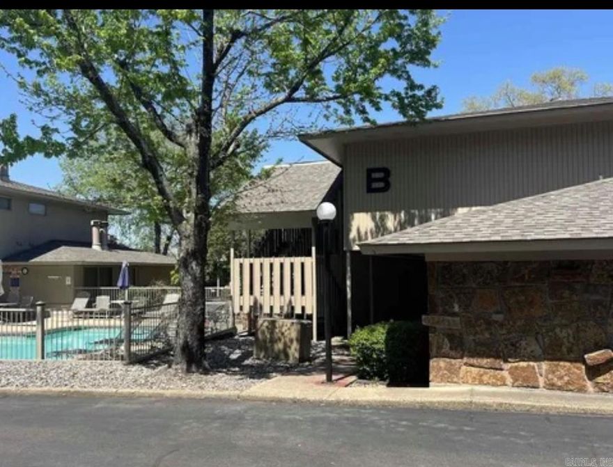 Welcome to Pier West, a 24 unit complex inside the city limits. This ground level condo is located on Lake Hamilton, close to many restaurants, Oaklawn Racing, and the historic bath houses. This unit is located in a prime location, but is quite and peaceful.  Almost every room has a view of the lake. It is the perfect place for one looking for a relaxing retreat. There are endless entertainment opportunities with a pool, grilling on the patio, fishing on the boardwalk, and a swim dock! The main living area is open concept. The living room is spacious with a wood burning fireplace and large, magnificent windows that boast a view of the lake and provides tons of natural light. The kitchen has granite counter tops, a large island, and considerable amount of storage. Each bedroom has a full bathroom with walk-in closets. The master bedroom has a fireplace and remodeled walk-in shower in the attached bathroom. The unit has newer LVP, tile in wet areas, and has been painted within the last 5 years. Newer appliances will convey. The location is pet friendly. Condo fee covers garbage, water, and sewer. Make this condo your primary home or weekend getaway!