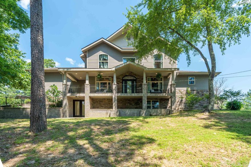 This gated hilltop estate is nestled on 4 peaceful acres with stunning views of the surrounding countryside. Originally a custom builder's personal home, the quality craftsmanship & pristine finishes are apparent throughout the home. The spacious floor plan boasts soaring ceilings, abundant windows with remote blinds, & heated floors on the main level. The stunning chef's kitchen is complete with a private butler's pantry, perfect for preparing culinary masterpieces behind the scenes for your guests. The master suite is also located on the main level, and has an en-suite bath with a beautiful walk-in shower & oversized closet. The outdoor living space features a relaxing hot tub on the lower patio, a fully-equipped kitchen including a brick oven, & an upper deck to soak up the sunrise views. In addition, there's a family/flex room upstairs, a heated/cooled bonus room with exterior access downstairs, and a 40X40 shop. This striking home offers a unique opportunity to experience the perfect blend of luxury, comfort, and natural beauty. Whether you're looking for a peaceful retreat or an entertainer's paradise, this property is sure to exceed your expectations.