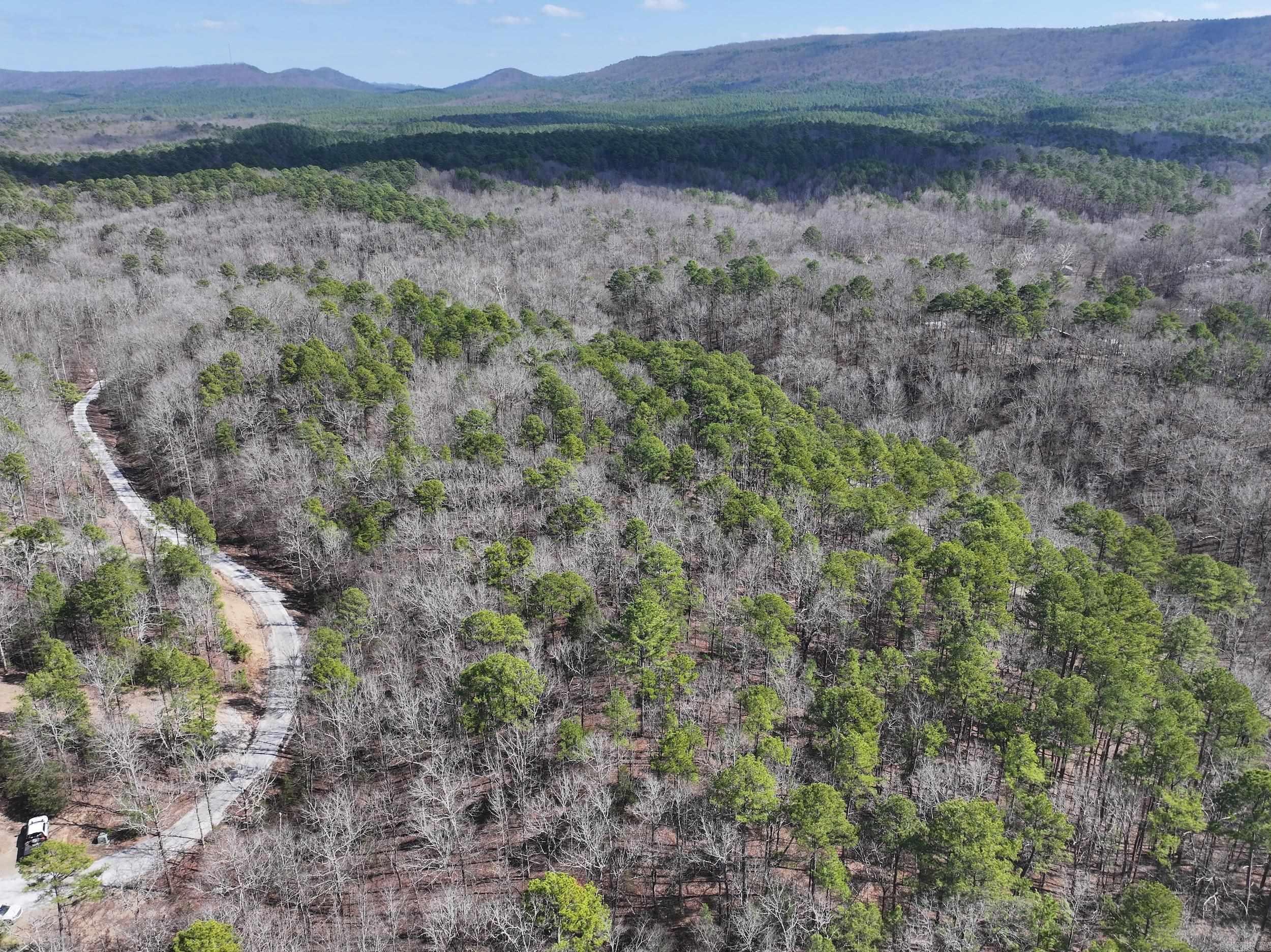 Located at 205 Denby Cove, Mount Ida, AR, just one mile from Lake Ouachita, Lot 18 in Denby Cove Subdivision offers 3.15+/- acres in a gated community with paved roads, city water, and underground electric already available. This lot provides a great opportunity to build with ample space and a convenient location near the lake. Just minutes from Lake Ouachita and a short drive to Hot Springs, this property offers both accessibility and natural beauty. An additional lot is available and can be purchased together, MLS# 25007482