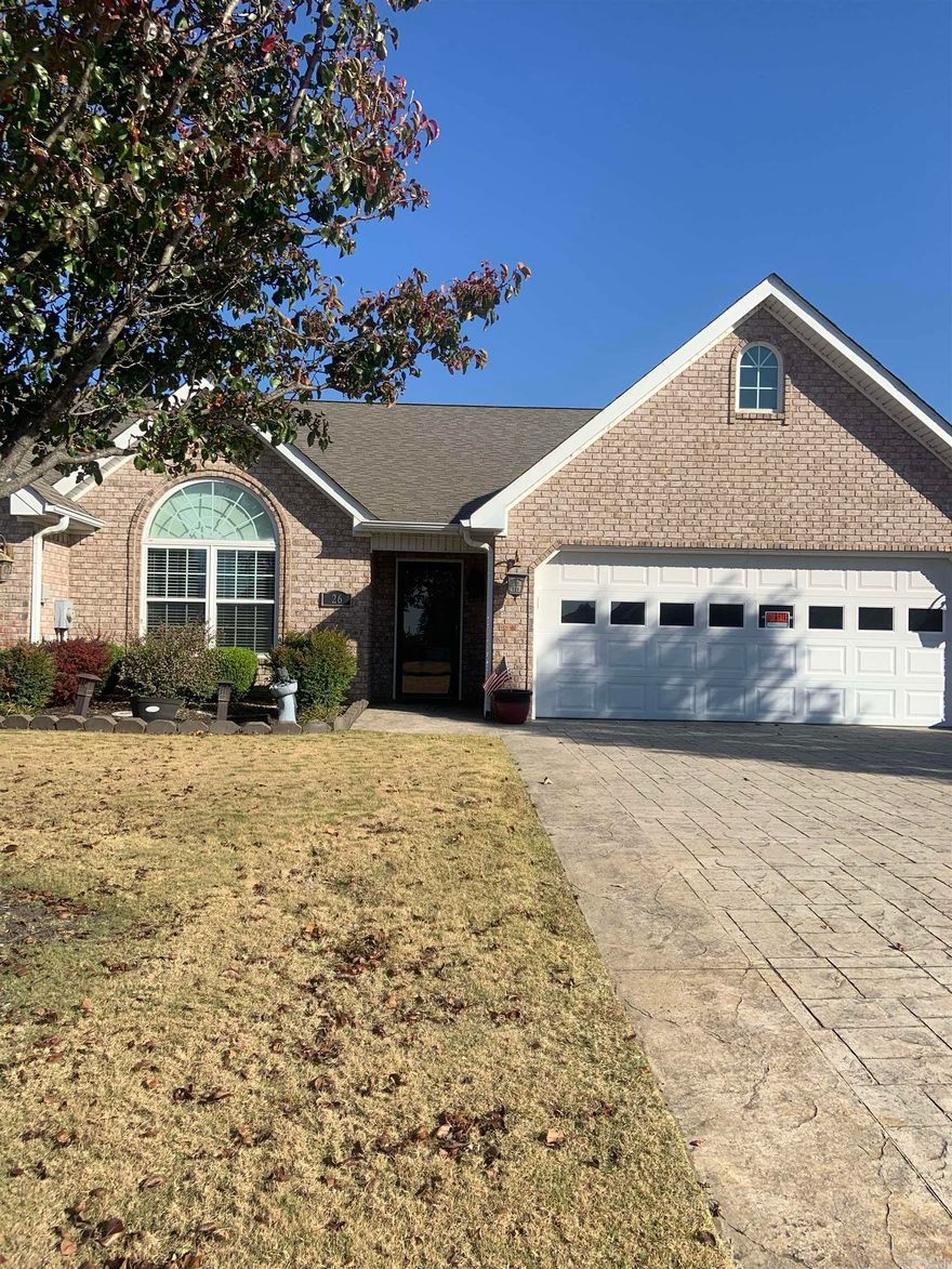 Beautiful 2br, 2ba Condo in The Enclave near Country Club.  Living/Dining Combo with gas log Fireplace, built in bookcases and shelves, Custom white kitchen cabinets w/all stainless appliances, breakfast room.  Heated & Cooled sun room that opens onto the patio w/pergola.  Hardwood, carpet and tile flooring. All neutral paint colors.  Roof replaced in 2023.  See Agent Remarks