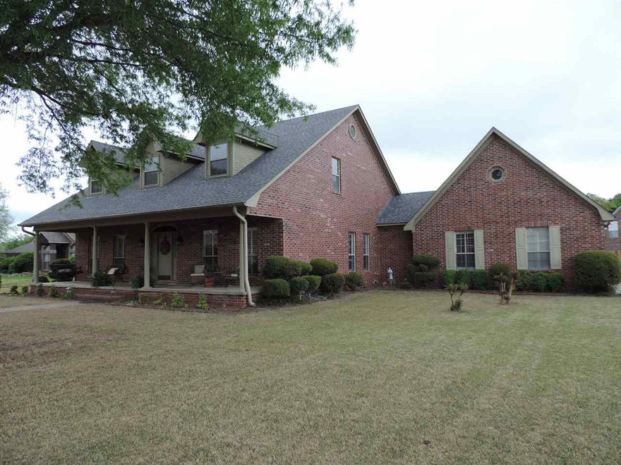 Woodland Springs Beauty, main level master suite, over-sized family room with french doors, plantation shutters, hearth room with fireplace, stainless appliances, abundance of cabinets & storage, custom tile shower, 16x32 pool with diving board, extensive decks, add'l room above garage not included in SQ FT. (See agent remarks.)