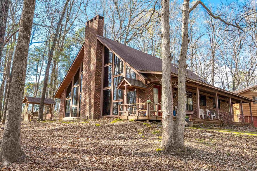 Welcome to this one of a kind charming retreat. Gorgeous vaulted wood ceilings and huge picture windows add the most amazing vibe to the living space and allow nature and light to fill the home.  In addition to the beautiful four bedroom two bath home is the 1 bedroom 1 bath apartment over the garage allowing for a mother in law suite or even an income producing property! Lots of amazing updates in the kitchen and bathrooms, new paint & flooring as well as a new hvac. Nestled down at the end of a cul da sac and conveniently located to the Arkadelphia amenities! This is the one! Just imagine watching  a storm roll in or a white winter gracefully falling around you..... what a cool place to call home! Call and lets get your showing scheduled today! Pre-Approved buyers only. Seller is willing to give a $3,000 repair allowance at closing for any little repairs that may come up on inspection.