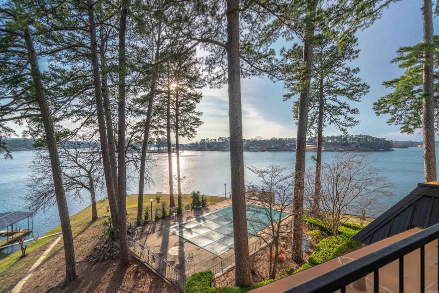 Experience waterfront living at this 2-bedroom, 2-bathroom condo overlooking Lake Hamilton. Comes Fully furnished and includes covered boat slip with lift, so you're ready to experience life on the lake, whether it's your weekend getaway or your everyday oasis. Enjoy breathtaking panoramic views from the large balcony or take a dip in the swimming pool just steps away. Nestled within a gated community, just minutes from everything Hot Springs has to offer. Don't miss out on this rare opportunity to own one of the few units on the point of the Twin Points peninsula!