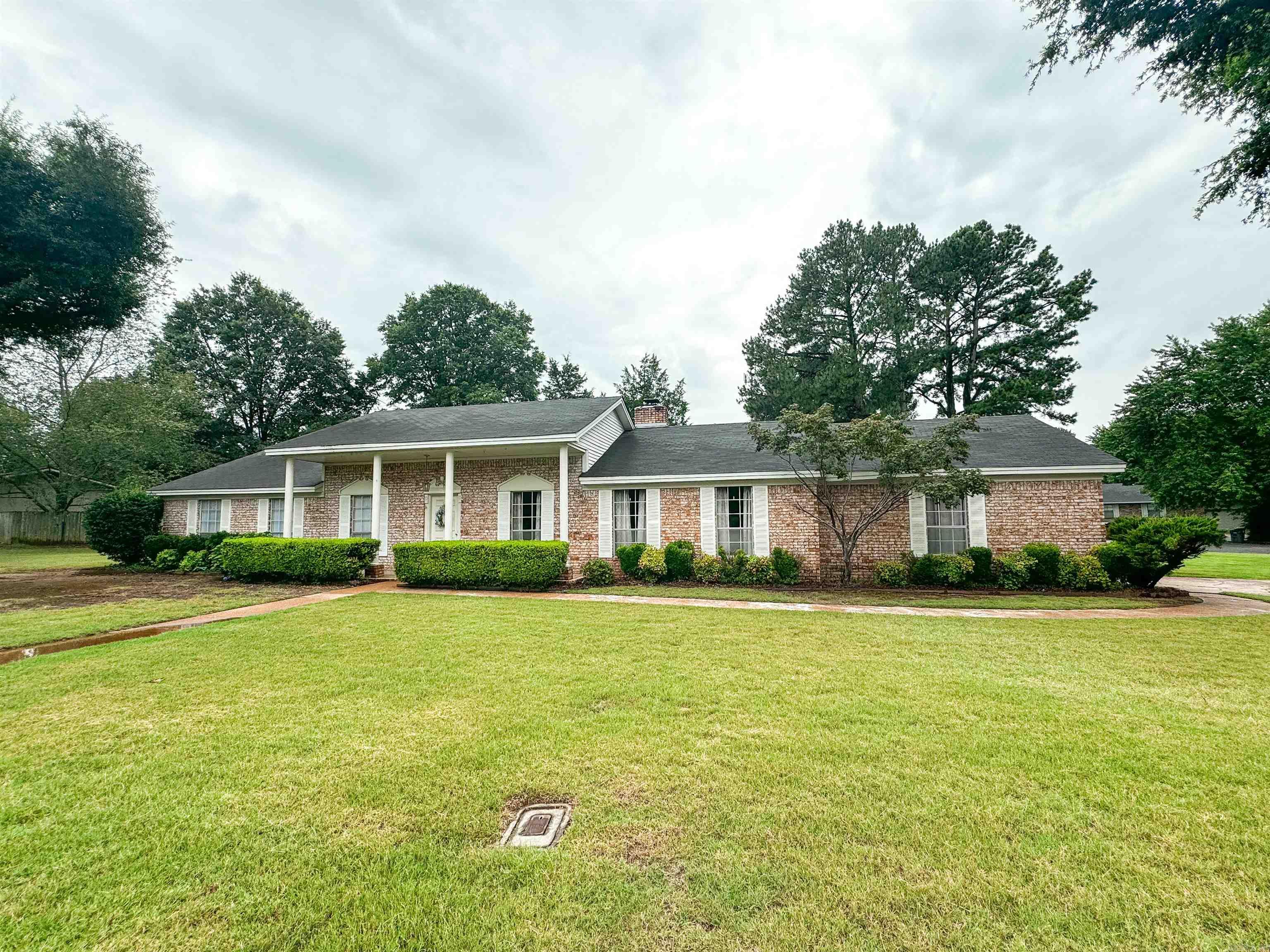 Take a look at this spacious home in an established neighborhood with 4BR/2.5BA, two living areas and two dining areas! This is a one-owner home that has been well cared for and is located on a nice corner lot that is over a half acre! Other features include a large formal living room/formal dining combo, family room with a wood-burning fireplace & built-in book shelves, a quaint breakfast room, newer stainless appliances, spacious bedrooms, walk-in closet in the primary bedroom, outdoor storage building & more. Call today to view this lovely home in west Searcy!