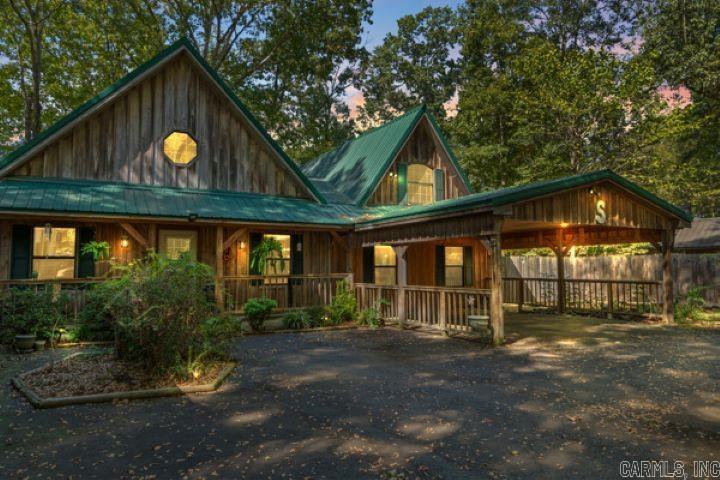Welcome to this breathtaking riverfront custom built Cabin on the Little Red River! This home is meticulously crafted with quality and style in mind. This property blends timeless rustic charm with upscale modern finishes and the custom built log furniture, and rustic decor convey with the property. Just imagine coming home to enjoy elegant granite countertops, permium tile flooring, sky lights, and an open concept layout that maximizes natural light and showcases breathtaking river views. You will love the garden jet tub after a hard day at work. You, your family and friends will love the game room with a pool table, air hockey game, and a arcade game system that convey with this home. An expansive deck creates the perfect space for outdoor entertaining, while beautifully designed rock landscaping enhances the natural beauty. Your private dock provides direct access to the river, ideal for fishing, kayaking, or enjoying breathtaking sunsets. Pangburn is just minutes from Greers Ferry lake for even more fishing, swimming, boating, camping, and hiking!