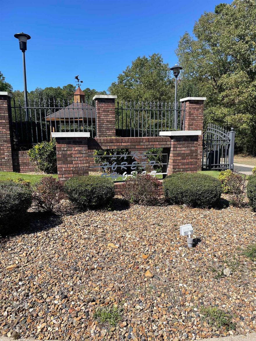 Investors and Builders- What a great area to build, beautiful on lake and off lake properties in Lake Hamilton district Neighborhood. This Lot 4 offers privacy, lake views, lake access boat ramp across the street, sewer and electric utilities at the street.  Gated entrance but no POA or restrictions!