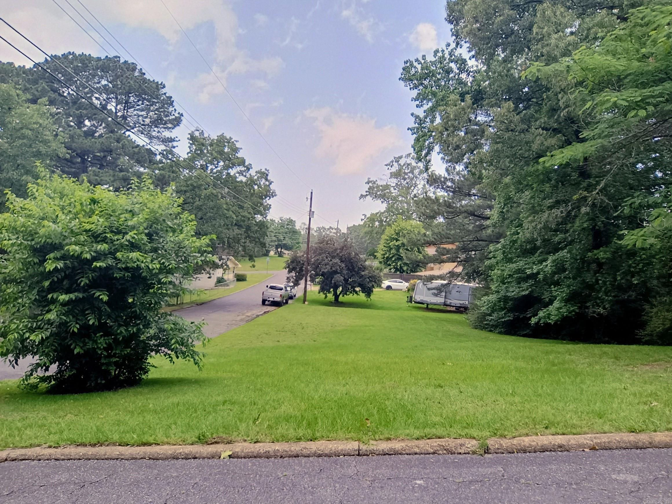 Don't miss this exceptional opportunity to own a cleared and build-ready corner lot in the heart of Hot Springs! Conveniently located with utilities available at the street, this property offers a hassle-free start to your dream home or investment project. With mature infrastructure and close proximity to shopping, dining, and all the amenities Hot Springs has to offer, this lot is truly a rare find. Whether you're a builder, investor, or future homeowner, this is your chance to secure a valuable piece of land in one of Arkansas’ most vibrant and historic cities.