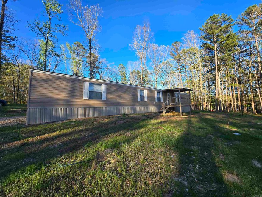 Freshly set up, year round flowing creek, huge yard -beautiful country living! Welcome to 154 Breckenridge Court. Located on a little over 2 acres in Lake Hamilton School District next to Mazarn Creek. This 3 bed 2 bath mobile home is newly set up and has never been lived in by the seller! The bottom half of the property is freshly cleared and leveled, ready to build your forever home or a new shop. Out of city limits, all electric, septic, Kimsey water, new front porch, back steps, roof, and not in a flood zone! You don't want to miss this! AGENTS SEE REMARKS