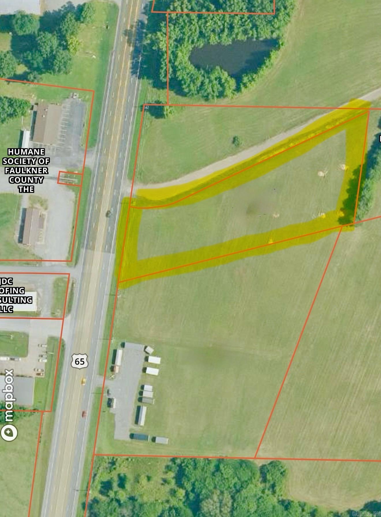 Great business opportunity on HWY 65 towards Greenbrier! Two acres of prime property right on the highway in a high traffic area with development all around.