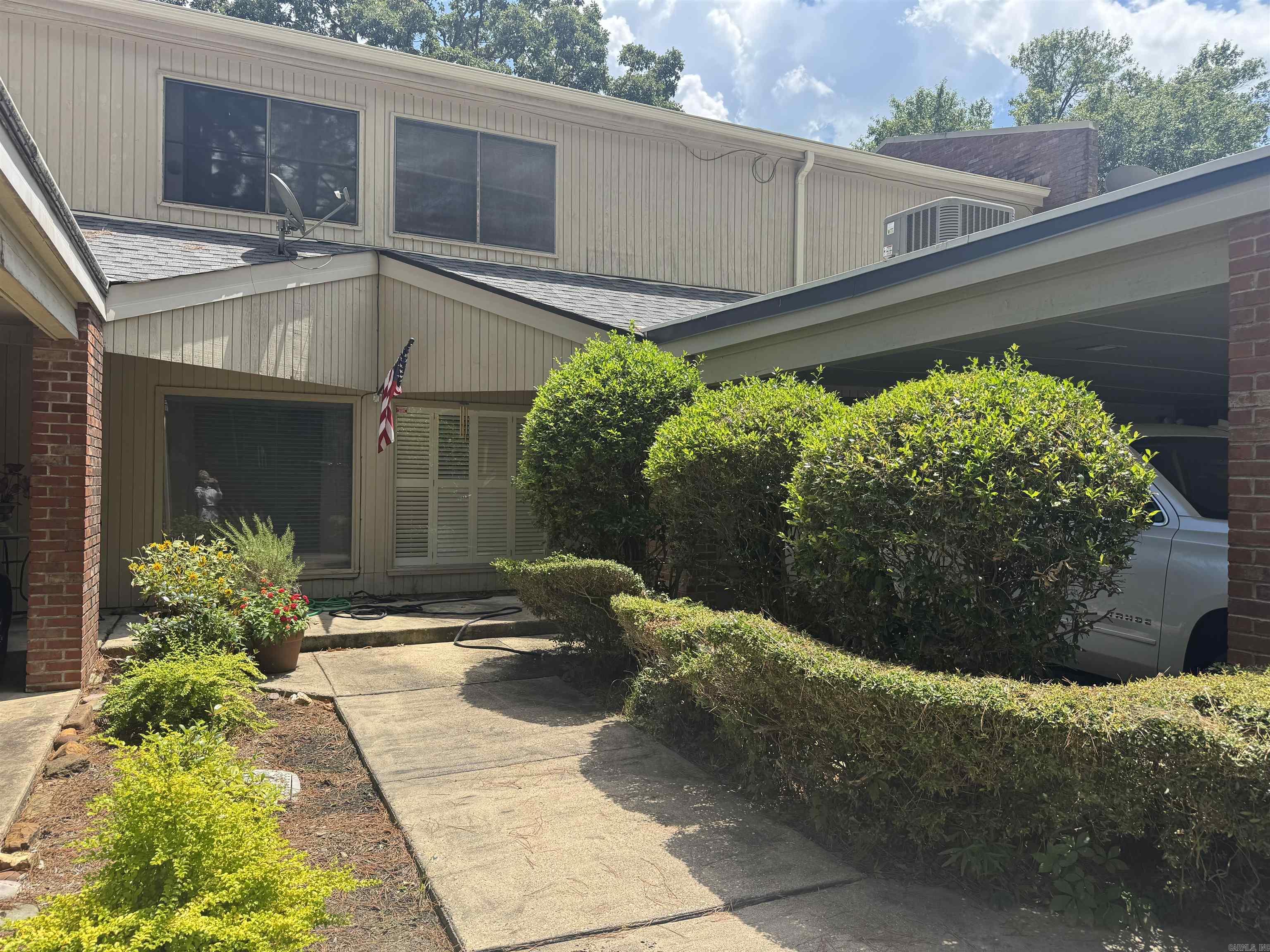 LIVE THE COUNTRY CLUB LIFESTYLE! Nestled adjacent to the prestigious Pine Bluff Country Club, this beautifully updated, 3 bedroom, 2.5 bath townhome offers 2257 square ft of refined living across two stories. Enjoy the exclusive residents-only pool or take a short walk to the golf course or country club pool! Surrounded by beautifully maintained grounds, this home combines low-maintenance living with scenic charm. Inside, you will find spacious living, thoughtful updates. and a layout designed for both comfort and entertaining. A rare opportunity to live in one of Pine bluff's most desirable communities.