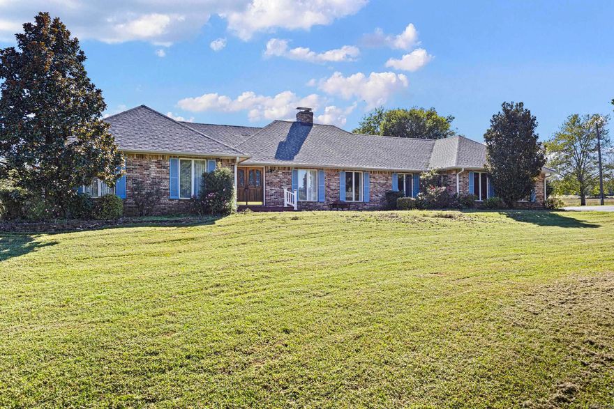 Welcome to your dream countryside estate! This expansive property offers approximately 2904 sq. ft of comfortable living space, nestled on an impressive 27.80 acres of beautiful pasture. A circular drive welcomes you home where you will find plenty of charm and functionality throughout. The kitchen features Jenn-Aire stovetop and a separate grill, granite countertops, a new oven with above oven microwave in 2023, wet bar with micro fridge, trash compactor and plenty of storage. The property has three wells, including an artesian well, rural water to house, a 40X50 barn, 30X50 shop built in 2021 with a three-car garage. The Generac whole house generator and Geo-Thermal system were installed in 2023 making this home energy efficient. Along with the ADT security system, it's a self-sufficient retreat that combines comfort and rural beauty - come see it for yourself.