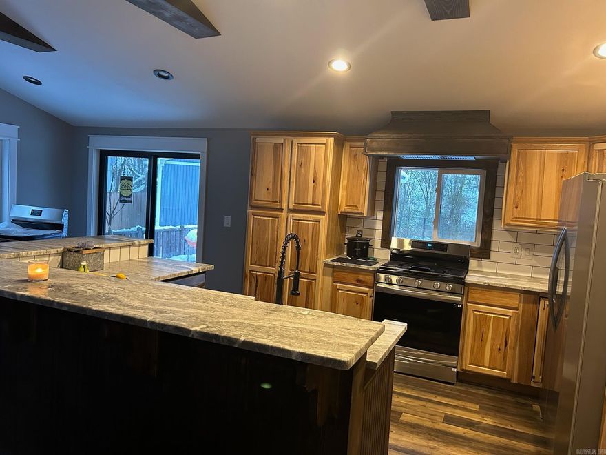 This Property is a great Home or possible VRBO investment, The Main house has a vaulted ceiling in the open Kitchen/Living area, Granite countertops, and other updates, Direct access to Hot Springs Creek and Hot Springs Greenway, launch your Kayak off of this property or use the new Greenway Public Kayak launch area 800 feet away, Walk or Ride your bicycle all the way to downtown Hot Springs on the Greenway, There is an Awesome newly built Man Cave/Shop/Dog Kennels building that has Lots of Personality! NOTE: BETTER PHOTOS COMING SOON.