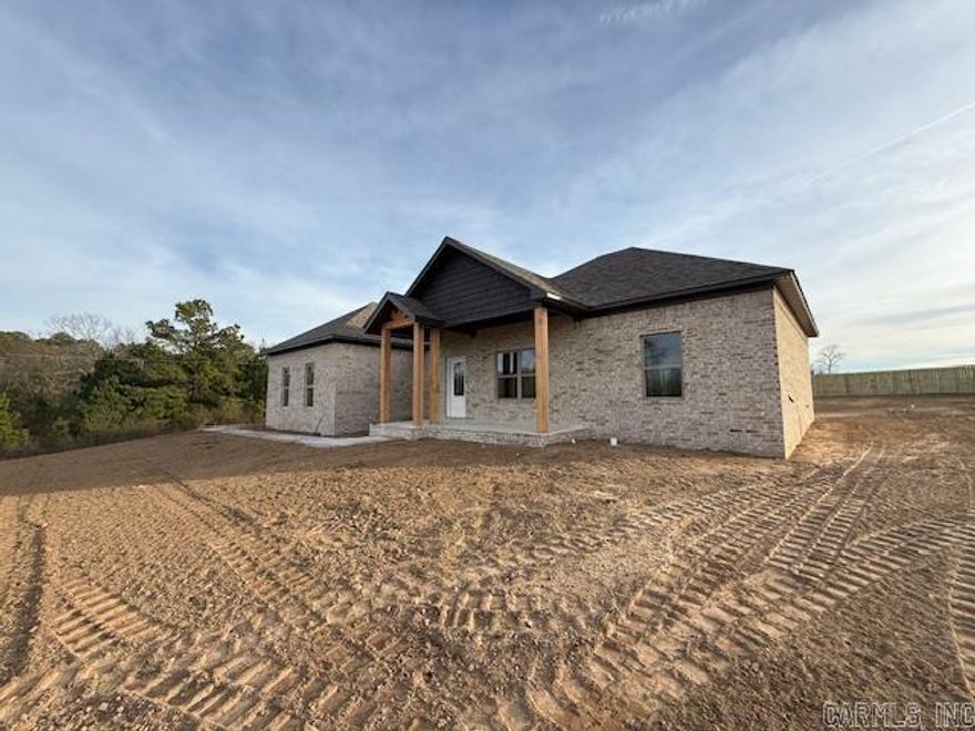 Fantastic new construction home on just under 1 acre. This home has some nice extras: High ceiling in the living room, attractive vent hood above the stove, electric fireplace, granite countertops, huge pantry with microwave in the pantry, island, laminate vinyl plank flooring throughout and a large laundry room with lots of cabinets. Backyard is partially fenced. Completion at the end of December.