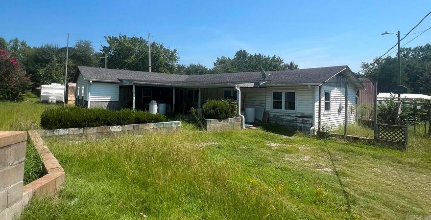 LOOKING FOR A HOME WITH LOTS OF POSSIBILITIES, YOU HAVE FOUND IT! THIS HOME IS AN INVESTORS DELIGHT!! IN THE RURAL AREA OF HARTMAN...  THIS HOME IS OVER 1800 SQFT, 3 BEDS AND CURRENTLY ONE BATH.  HOWEVER THERE IS AN AREA IN THE MASTER BEDROOM THAT WAS GOING TO BE A MASTER BATH, WHEN THE CURRENT OWNERS WERE REMODELING.  YOU WILL FIND MANY OPTIONS WITH THIS HOME.  ITS READY FOR YOU TO MAKE IT ALL YOURS!!