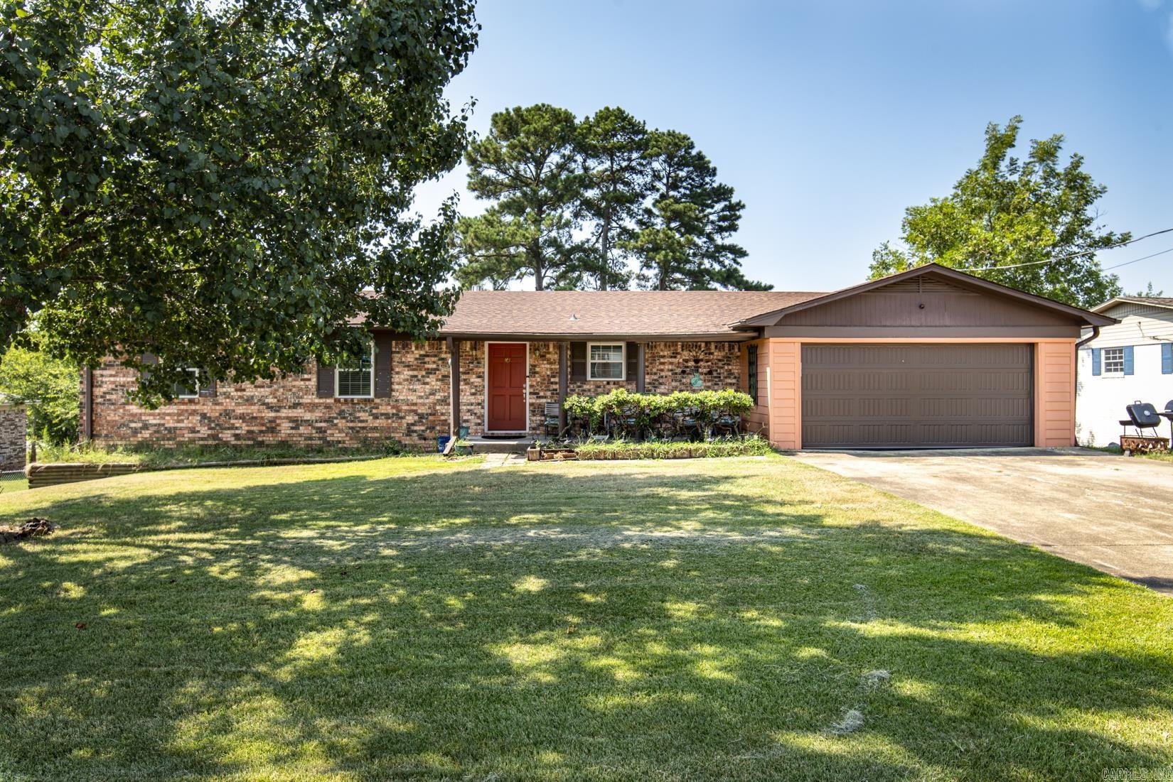 This lovely six-bedroom, three-bathroom home in Hot Springs offers a spacious open floor plan and is located just minutes from Lake Hamilton. The interior features modern finishes throughout, including a renovated kitchen with contemporary countertops and appliances. The living and dining areas are designed for the functionality and flow, providing ample space for everyday living and entertainment. The property includes outdoor space suitable for a variety of uses and is in the center of dining, shopping and ALL thing Hot Springs has to offer. Call me today for your private showing.