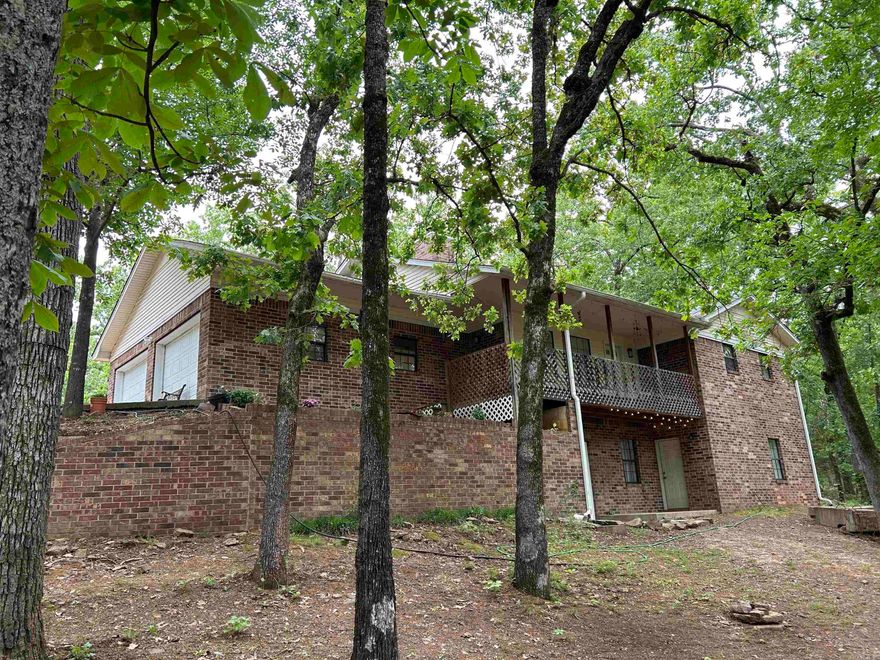 This is a slice of secluded paradise! 3 quiet, wooded acres, featuring a detached garage/shop, an additional 50 x 50 metal building, with a great home as the cherry on top! Don't miss the cozy sunroom, or the versatile bonus room downstairs - den, movie room, game room, bedroom... endless possibilities! Sit up on your porch and watch the deer move around the front yard.