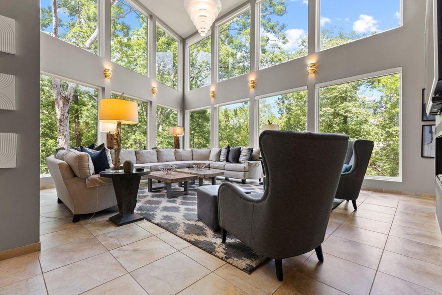 Prepare to be awestruck by this architectural marvel nestled in nature's embrace! This cutting-edge contemporary home seamlessly blends with its breathtaking surroundings of the historic Hillcrest neighborhood, offering a living experience that's nothing short of extraordinary. Step inside and be captivated by sweeping open spaces flooded with natural light, a culinary haven for aspiring chefs and entertainers alike. Your private cinema stands ready for unforgettable movie nights. Four luxurious bedroom suites, including a spa-inspired primary retreat. But wait, there's more! Ascend to the crowning glory – a rooftop oasis boasting  panoramic views of Allsopp Park complete with a bubbling hot tub for ultimate relaxation. The rich IPE wood decking set this home apart. This SMART home leaves no stone unturned in the pursuit of luxury.  Sleek glass railings for unobstructed view. The home includes state-of-the-art audio throughout and countless other premium upgrades. Effortlessly navigate all four levels via the built-in elevator. This isn't just a house – it's a masterpiece designed for those who demand the extraordinary. Your dream of modern luxury living awaits! See agent remarks