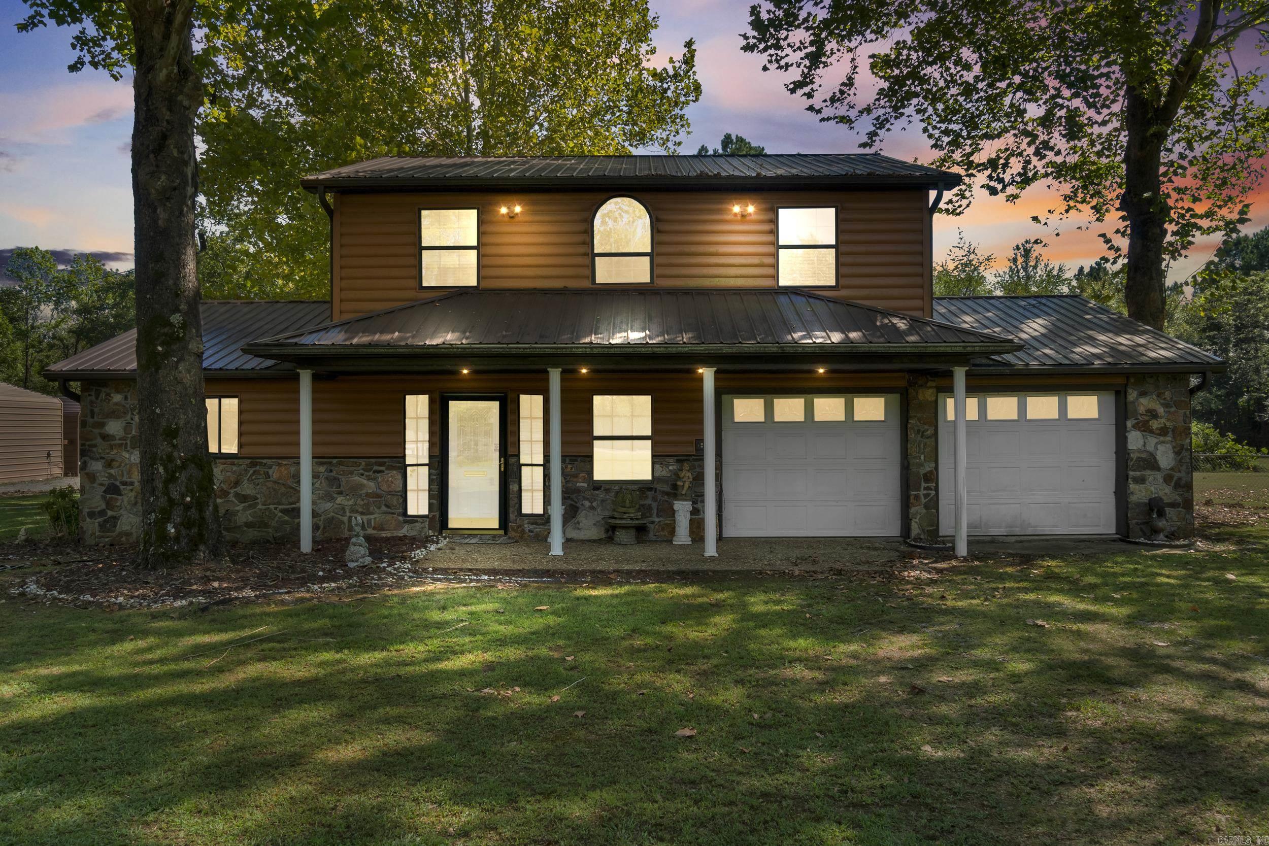Come see this well-maintained 4 bedroom, 2.5 bath home with a shop, located just minutes from the Air Force Base and Sherwood! With its charming log cabin exterior, this property offers plenty of space and character. The home features a storm shelter, large fenced yard, and the added bonus of an open lot next door. Inside, you’ll find a new HVAC system, updated appliances, and a huge primary suite that has been recently remodeled. With a few cosmetic updates, this home has the potential to truly shine. The property is being sold as-is. Two properties on each side of the home are also available for purchase under separate MLS #25038862, #25038863 and can be sold as a package deal. AGENTS SEE REMARKS.