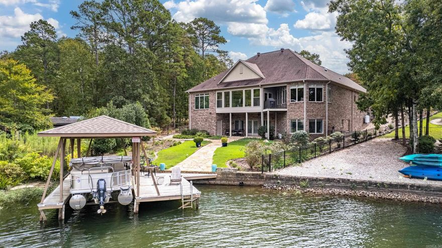 Welcome to your dream home on Lake Balboa in the picturesque Resplandor neighborhood! This exquisite, one-of-a-kind residence offers functionality and breathtaking lake views. From the moment you step inside, you'll be captivated by the craftsmanship and thoughtful design.  The heart of this home is the gourmet kitchen with granite countertops and custom cabinetry, perfect for preparing meals and entertaining guests. Gather with loved ones in the inviting dining room ideal for intimate dinners. Bask in natural light year-round in the four-season sunroom with amazing views of the surrounding natural beauty. The main level has a flex room that can be used as a music studio, theater room or even a possible 5th bedroom. Enjoy the ultimate retreat in the spacious primary suite, featuring 3 walk-in closets, jetted tub and double vanities. The versatile lower level is a true gem, complete with a kitchenette, living room, 2 bedrooms and full bath. This home boasts two 2 car garages, enough room to park 4 vehicles or create an amazing workshop! There is a newer Kohler generator and a recently fenced yard. New roof scheduled for installation, January 2024.