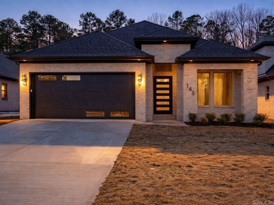 Quality construction, beautiful contemporary fixtures throughout the house. This two-level home offers 4 bedrooms and 3 bathrooms, open floor plan. The main living area is the heart of the home, featuring an open kitchen with oversized island, contemporary linear fireplace with floor to ceiling tiled mantel, tray ceiling with beautiful cedar beams, and a dry bar with a beverage cooler. Covered back porch offers cozy outdoor living with a gas fireplace and a gas line for a grille hook up. All baths have glass shower doors. Elegant primary bath offers contemporary soaker tub, shower complete with shower head, hand spray, rain can, and body sprays. Hall bath offers standing shower. All showers have tiled walls and glass doors. High efficiency HVAC, energy efficient Rinnai Tank less water heater, smart sprinkler controller, programmable thermostat, smart switches, wall mount fan controls, screwless switch/receptacle plates. Attic storage. No carpet, all wood. Green space in the back offers cozy privacy and relaxation in back porch. EV charging outlet in garage, all good stuff...