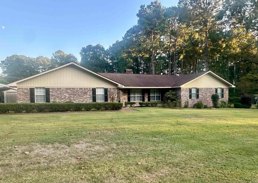 Discover the charm and comfort of this large 3-bedroom, 2.5-bathroom brick home situated in a prestigious neighborhood. This residence offers an exceptional blend of style, space, and convenience, making it the perfect place for families and entertainment.  Enjoy the versatility of two separate living spaces, floor to ceiling brick fireplace, spacious bedrooms, a convenient half bath for guests located off the large laundry room,  ample storage space throughout, attached two car garage, covered patio, fenced in backyard.... and yes! A 28x20 shop with roll up door with additional storage on back and a 16x30 and 12x20 carport, sprinkler system, and generac! This home is more than just a place to live; it's a place to thrive!  Lot size and taxes taken from courthouse records
