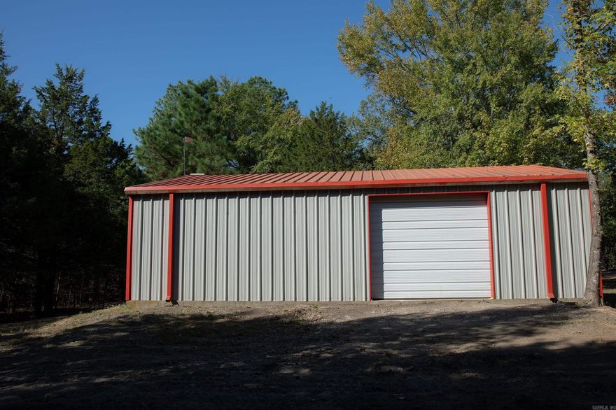 30’x40’ insulated metal building on 10 unrestricted acres in a great location between Quitman and Enola! This versatile property offers endless possibilities—build your dream barndominium, create a workshop, or enjoy a private storage building with plenty of room to expand. The building features insulation and gutters, and utilities are available at the road and nearby home. No restrictions and no perc test on file. Bring your plans and make this acreage work for you!