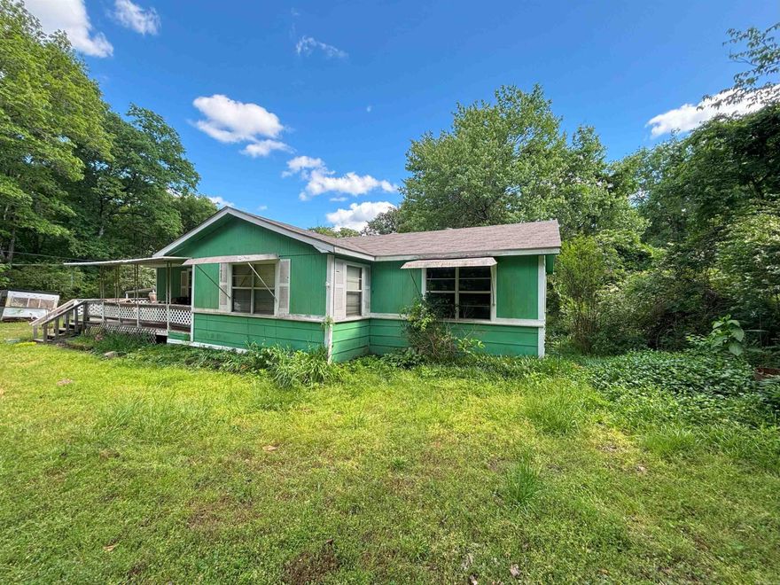 Charming home on a spacious 0.7 acre lot in a quiet rural subdivision. This home is located outside of the city limits, but is just minutes from town. With just a little TLC, this property would be great for a first-time home buyer, short-term rental, or long-term investment. Sold as-is.