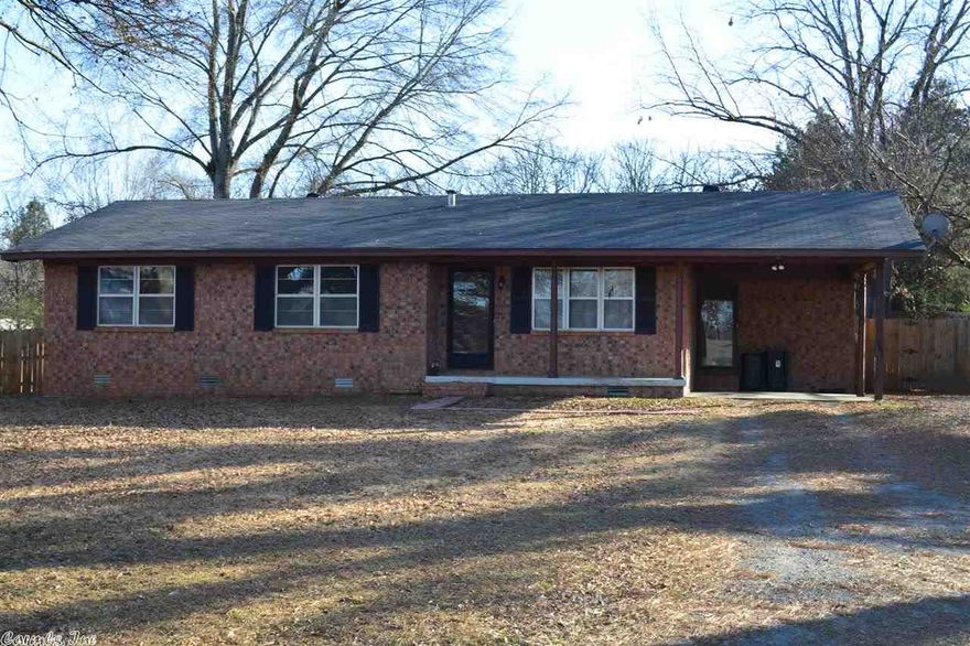 Nice 3bd 2ba home on 1/2 acre lot.  Many updates have been done since 2011.  Seller has torn up carpet in hallway, living rm, and bedrooms and refinished the original hardwood floors, Put laminate hardwood down in second living room that has fireplace. New Paint, New backsplash in Kitchen, New carpet in one bedroom. Fence in Yard. Washer, Dryer and Refrigerator convey.