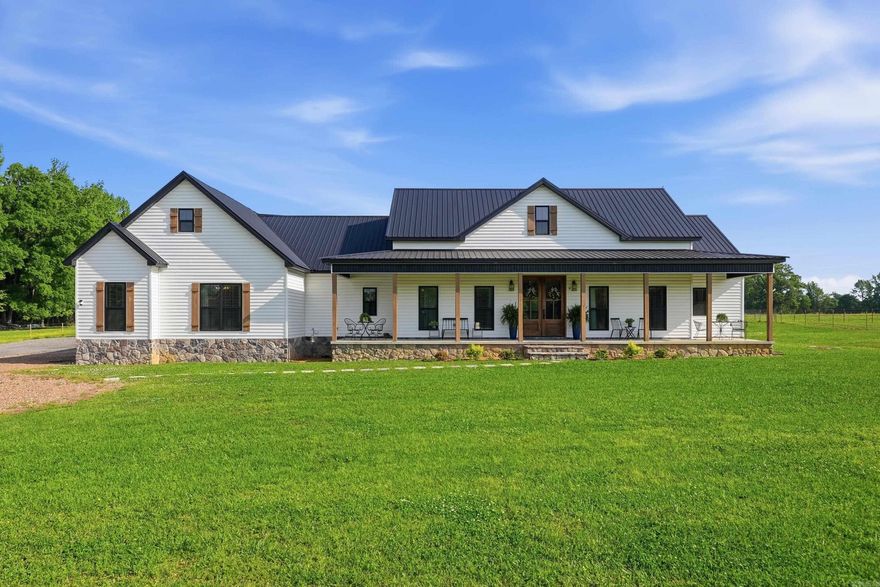 Wow, this custom-built property in desirable Wooster is a stunner! Featuring a main home offering 4 bedrooms and 2 bathrooms. The heart of the home is an expansive open-concept living, dining, and kitchen area spanning over 1,000 sq ft, highlighted by a cozy fireplace and vaulted ceilings. The kitchen is designed to impress with dual islands, granite countertops, and a large walk-in pantry. A separate guest house provides excellent flexibility with 1 bedroom, 1 bathroom, a safe room, and an attached garage—ideal for guests, extended family, or rental potential. Both homes include screened-in porches, tankless water heaters, and individual septic systems. The included 5 acres is ready for country living with plenty of space for horses or livestock, plus a chicken coop. If you’ve been looking for a move-in ready property with room to spread out that you'll never want to leave, this one checks all the boxes.