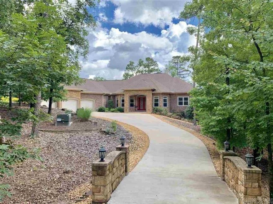 A WOW HOUSE.  From the time you enter the double iron doors of this custom home, you will be enthralled with every exquisite feature.   3 beds, 2.5 baths and oversized 3-car garage.  From the tranquil hot tub area to the exercise space, this property offers luxury living at its finest on the 11th hole of Diamante golf course.    Beautiful private golf course & subdivision in Hot Springs Village AR.  Diamante subdivision & country club is home to Golf Digest #4 ranked AR golf course.  Club amenities include world class tennis & pickleball, a private swimming pool & a wide array of dining & social events. Property owners receive 3 free rounds of golf each month for family & friends.  HSV is America’s largest gated community encompassing 26,000 acres, over 30 miles of walking trails, 9 golf courses and 11 lakes for fishing & boating.    HSV is 15 miles from historic Hot Springs National Park and Oaklawn Racing Casino Resort.  HSV POA has a buy-in fee of $2,000 for property owners new to HSV.