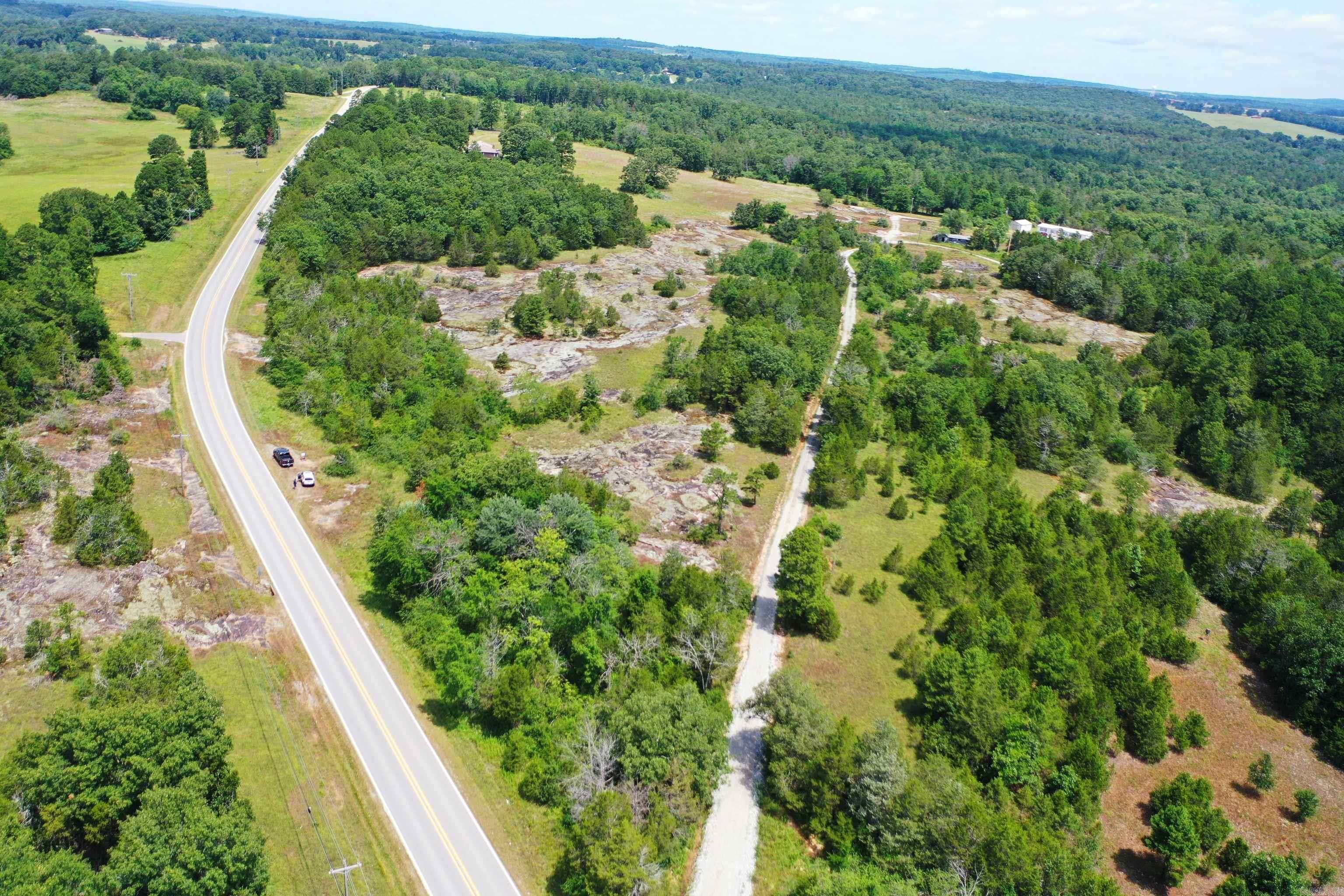 Great opportunity to own a piece of property in the Ozarks. Location along Highway 5, 1.5 miles north of Calico Rock. This gently sloping parcel has 9.44 acres m/l with over 1,200' of highway frontage. Electricity is available on the property. Partially fenced. Located less than 2 miles from excellent trout fishing, kayaking, and canoeing in the beautiful White River.