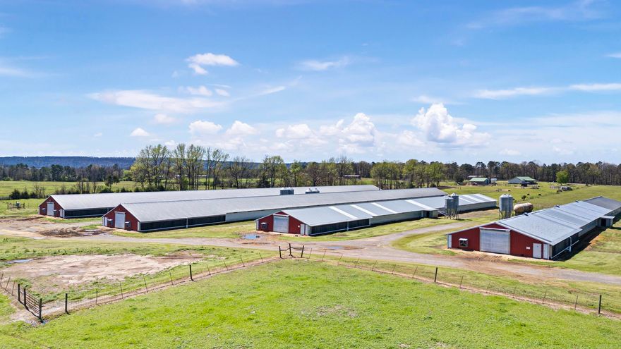 Beautiful Country Home sitting on 62 +/- acres (2 Parcels) 5 Poultry Houses that have all REQUIRED updates completed with Swimming pool and a greenhouse. A\C is 2 years old. All appliances, Refrigerator, Dishwasher, and Stove are a year old, bathrooms have been remodeled and Home is on Natural Gas. Property is fenced and cross fenced with 5 ponds, 1 water well. Little over 1/2 mile of County Road Frontage and .8 miles of Hwy 105 footage. 2 shops, 3 barns. Two 43x500, two 40x350, and 1 36x340 poultry houses, feed bins are not rusted, all cool cells are good, 2 generators (60 & 75 KW), Ecodrum. Bulk Propane tank for poultry houses, Natural Gas is available at all chicken houses. Equipment and houses all in good shape. New water lines in #1 house, all feed lines have turbo chick mates. Also has mobile home on property sold AS-IS. MINERAL RIGHTS WILL CONVEY.  Agents see remarks.