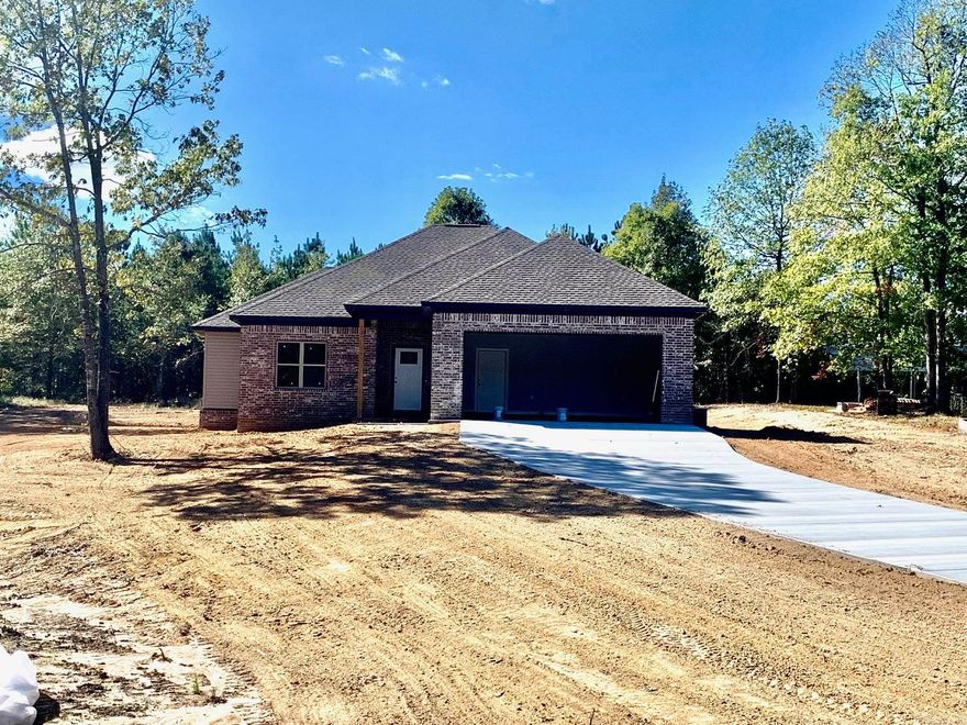 Charming new construction on a large county lot.  The home offers a beautiful setting with 3 bedrooms, 2 baths, large open floor plan with upgraded wood cabinets, granite counters and luxury vinyl flooring throught with tile in the wet areas, separate master suite with an extravagacant master bath inlcuding an all tile walk-in shower and walk-in closet. There's also a great extra nook in the garage entry and cabinets in the laundry room as well as a nice covered back patio. This home is eligible for a $0 down USDA Rural Development (RD) Loan! Contact me or your agent today for more information.