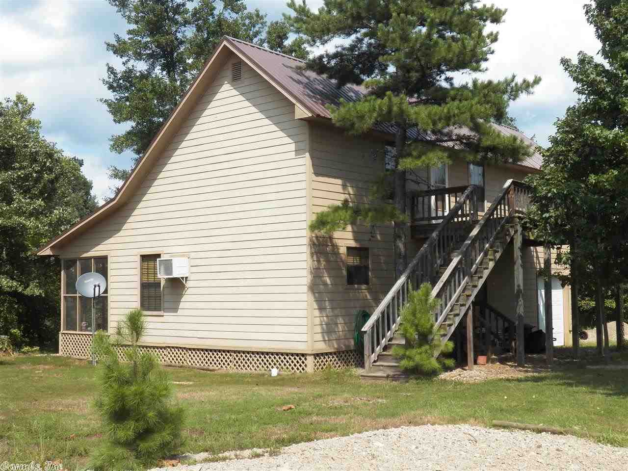 Clear Fork Creek less than 50 foot from screened porch on back of house and on high side of creek. Has flooded 2 times in 9 years and did NOT get in house. Joins national forest on 2 sides. Has hilltop building site. See agent remarks.