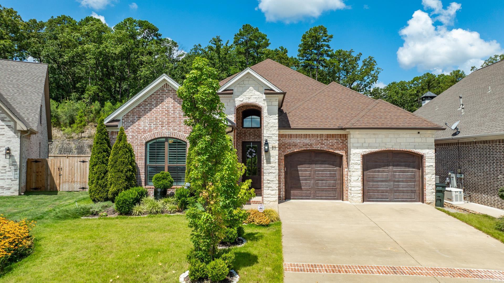 Donāt miss the opportunity to own this well constructed one-story home in desirable WLR! This exceptional all-brick like new residence is conveniently located within walking distance of a top-rated elementary school and just minutes away from shopping and dining. A stunning 9-foot wooden front door leading into inviting foyer showcasing an elegant barrel-vaulted ceiling; gleaming hardwood floor flow throughout the home; the open-concept floor plan seamlessly connects the living, dining, and kitchen areas. The living room boasts a gas-log fireplace; formal dinning area features a charming brick accent wall; adjacent to the living area is a gourmet kitchen that offers ss appliances, quartz counter tops & huge island, ample custom cabinetry and walk-in pantry. The primary suite has beautiful tray ceiling with assent lights; generously sized primary bathroom features hers and his vanities with quartz countertops, oversized tiled shower with dual entries and freestanding socking tub. The beautifully landscaped front yard enhance home's curb appeal; fully fenced backyard offers huge screened-in patio and outdoor fireplace, it is perfect for entertaining and gathering. Come to see today!